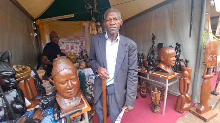 Cameroonian woodcarver offers free training to empower vulnerable youth.