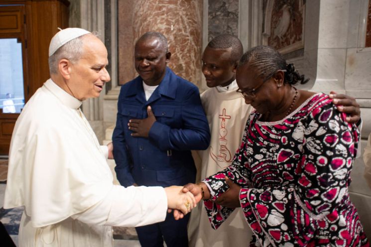 Father Claude Menounga Ngono, his parents and Pope Leo XIV soon after his ordination on June 27, 2025.