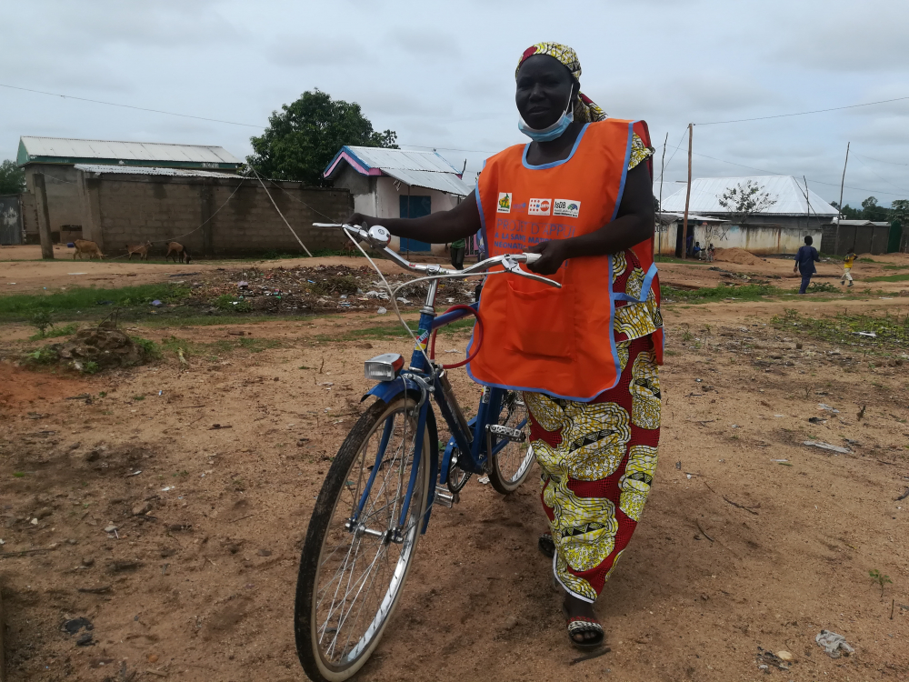 Mama’s sensitisation activities are eased by the project bicycle offered by the United Nations Children’s Fund, UNICEF.