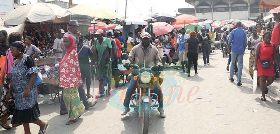 Vendors illegally set up makeshift sheds on parking lots, access roads to the Douala Central Market.