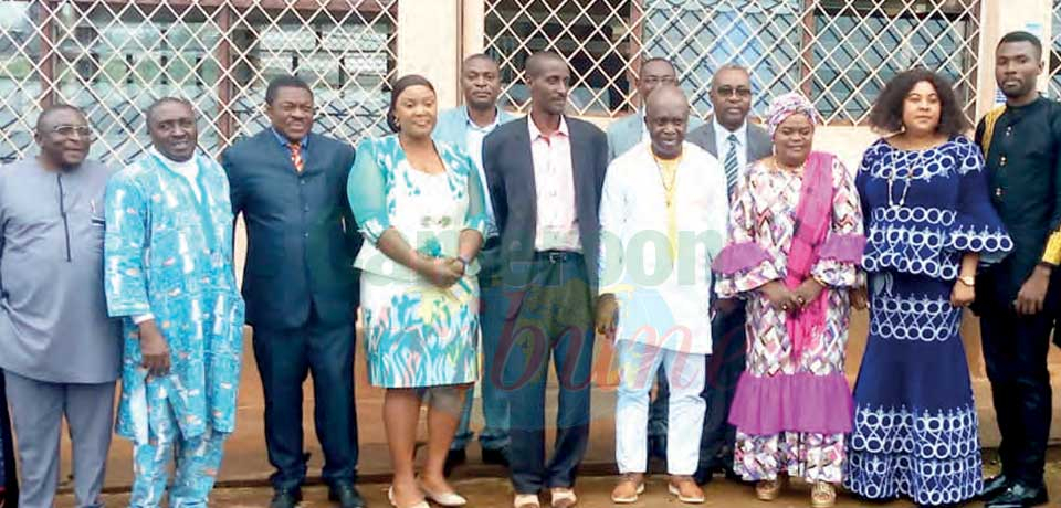 The newly appointed officials were congratulated by their family members and spouses who offered them bouquets of flowers and took photographs.