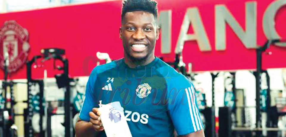 Onana brandishing his award. Onana brandishing his award.
