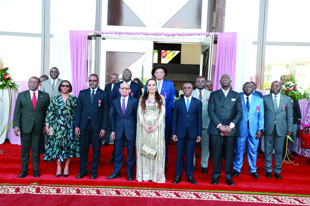 The happy recipients and officials hoping for better days ahead for the two countries.