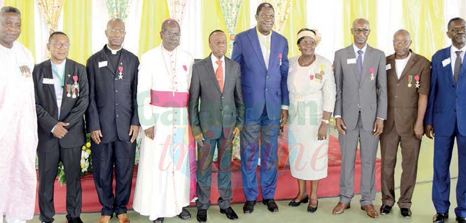 Professor Jacques Fame Ndongo with some of the meritorious staff.