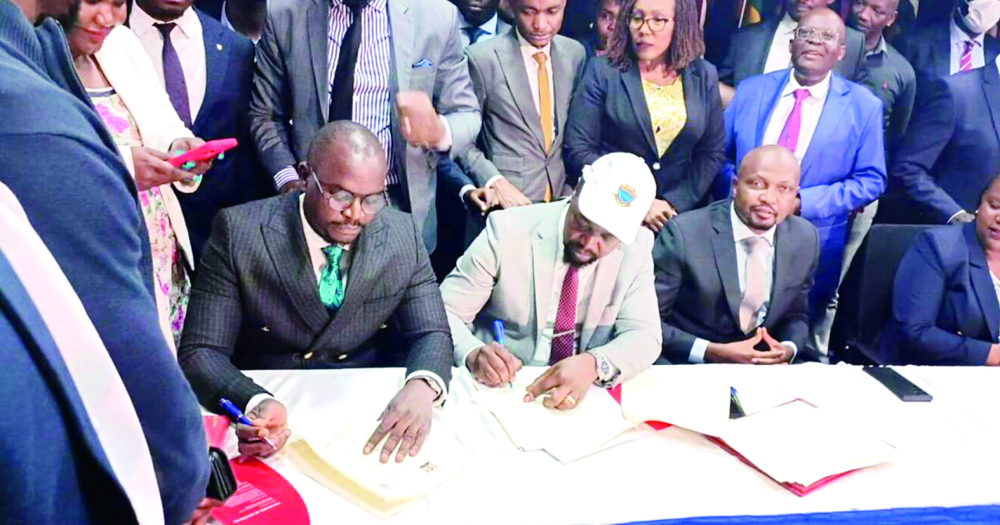 Government and Union officials during the signing.