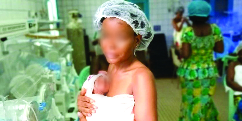 A mother providing kangaroo care to a preterm baby. A mother providing kangaroo care to a preterm baby.