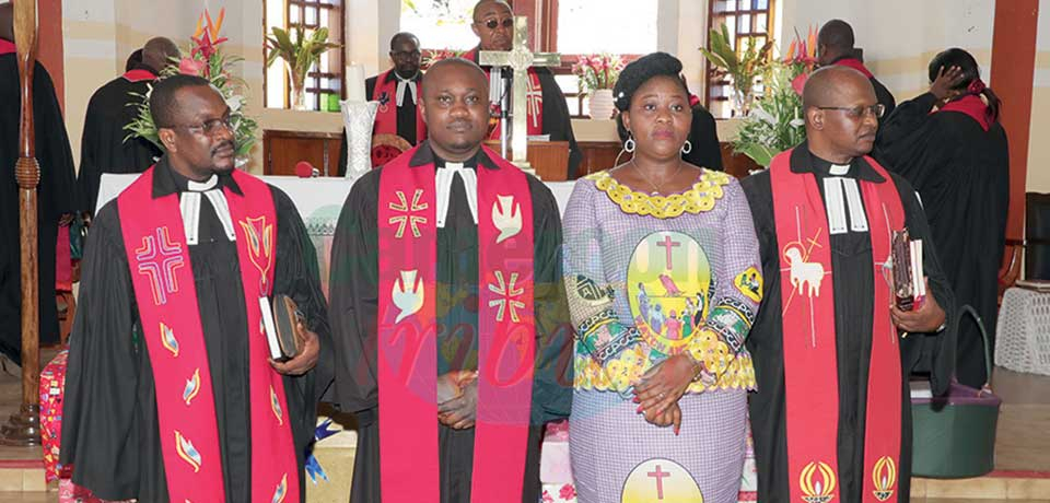 Rev. Enow Michael Agbor (on the right hand to his wife) after his induction. Rev. Enow Michael Agbor (on the right hand to his wife) after his induction.